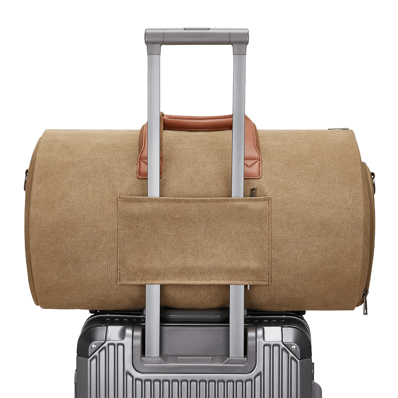 Sentier bag resting on luggage handle for travel convenience
